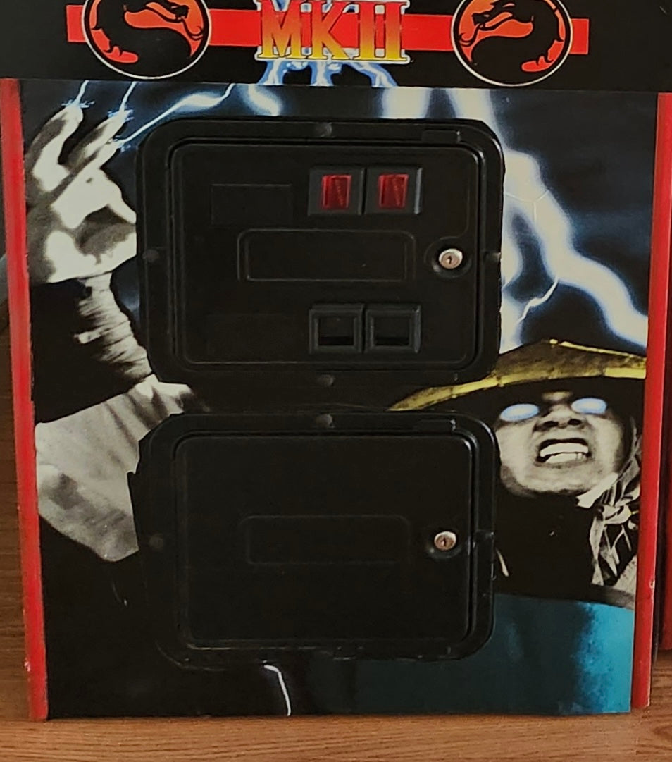 Arte de la placa de protección de Mortal Kombat 2