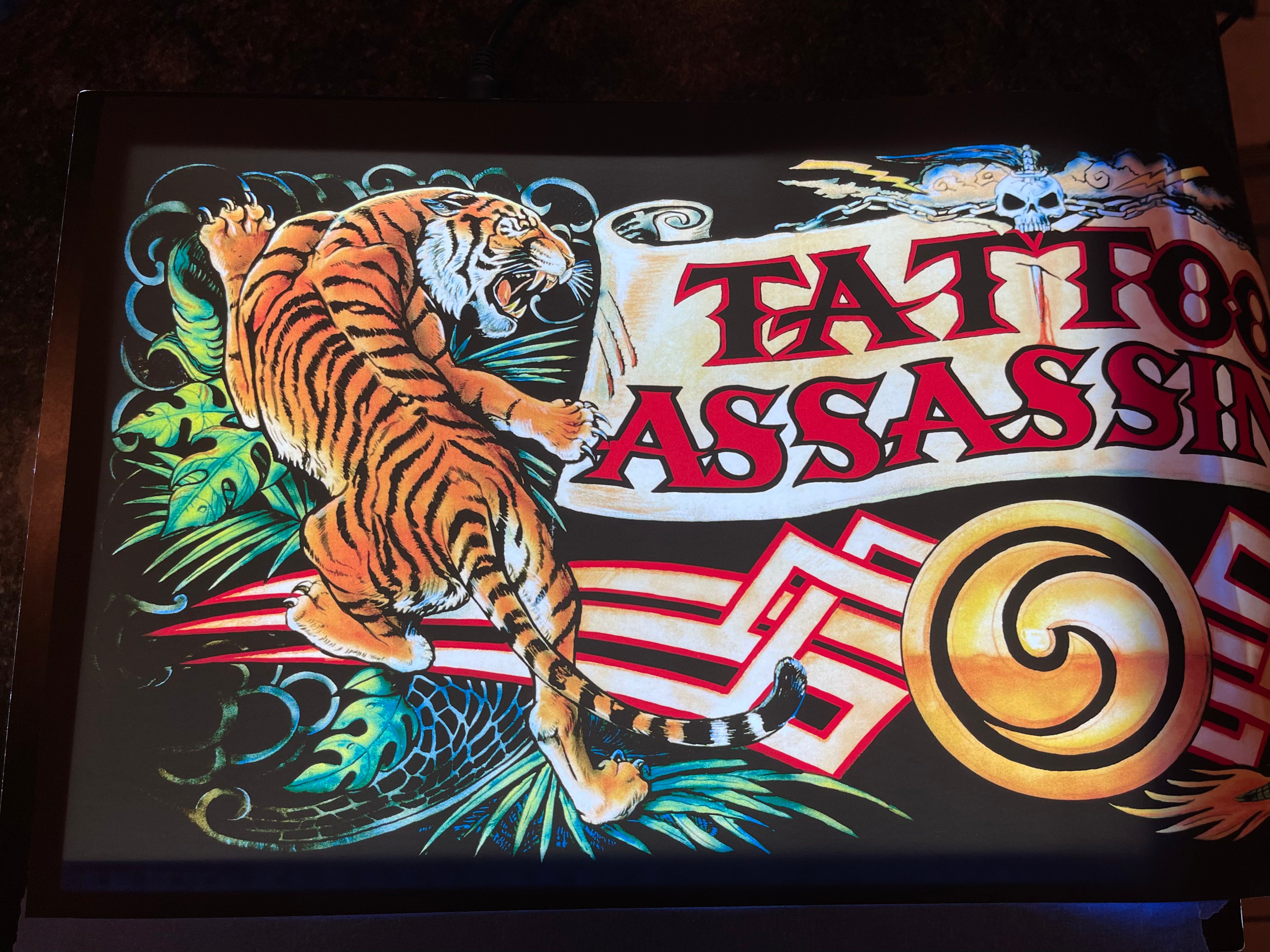 Carpa de asesinos de tatuajes